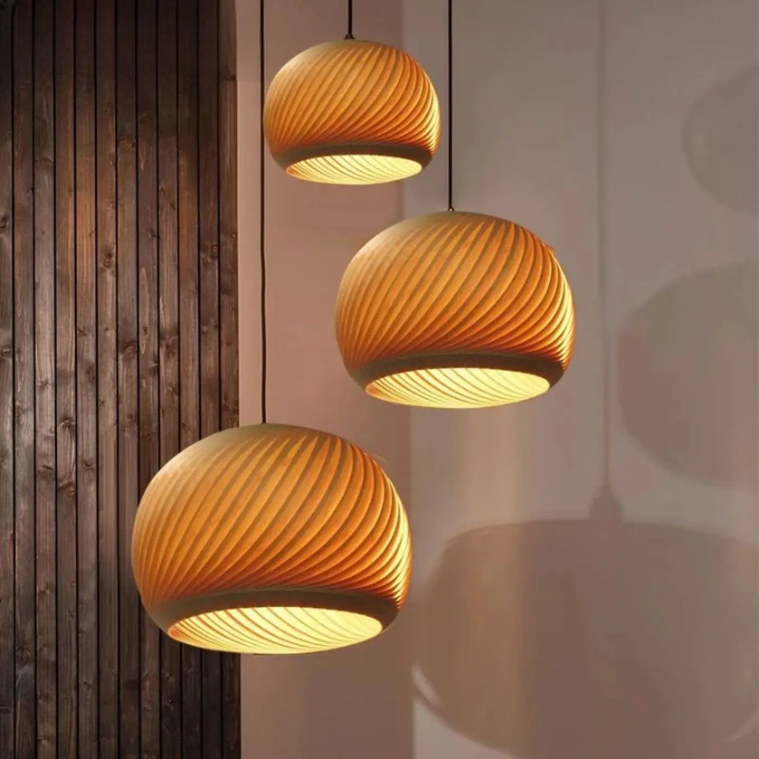 Three warm-toned suspension luminaire design with ribbed woven bois aux formes in wood or bamboo material clustered elegantly