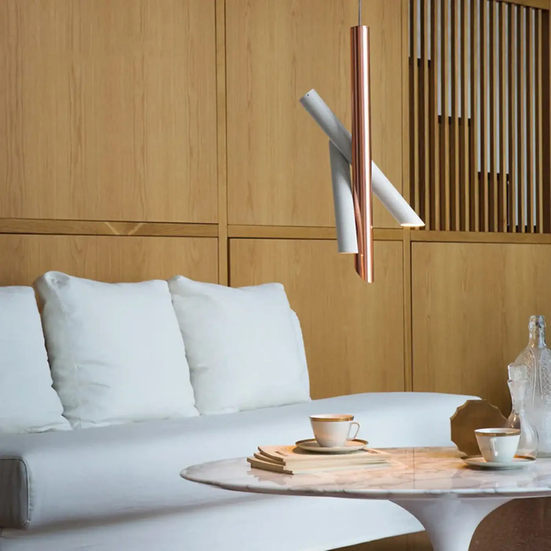 Suspension luminaire konto design tubes croisés avec finition cuivre et blanc en forme cylindrique moderne