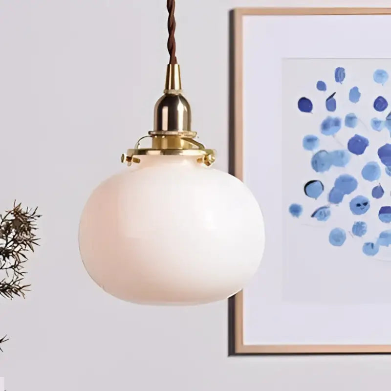 Suspension luminaire design verre et base dorée élégance moderne