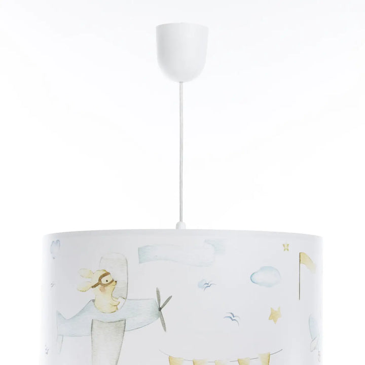 Suspension luminaire enfant blanche avec abat-jour cylindrique illustré d un lapin pilote et étoiles dorées