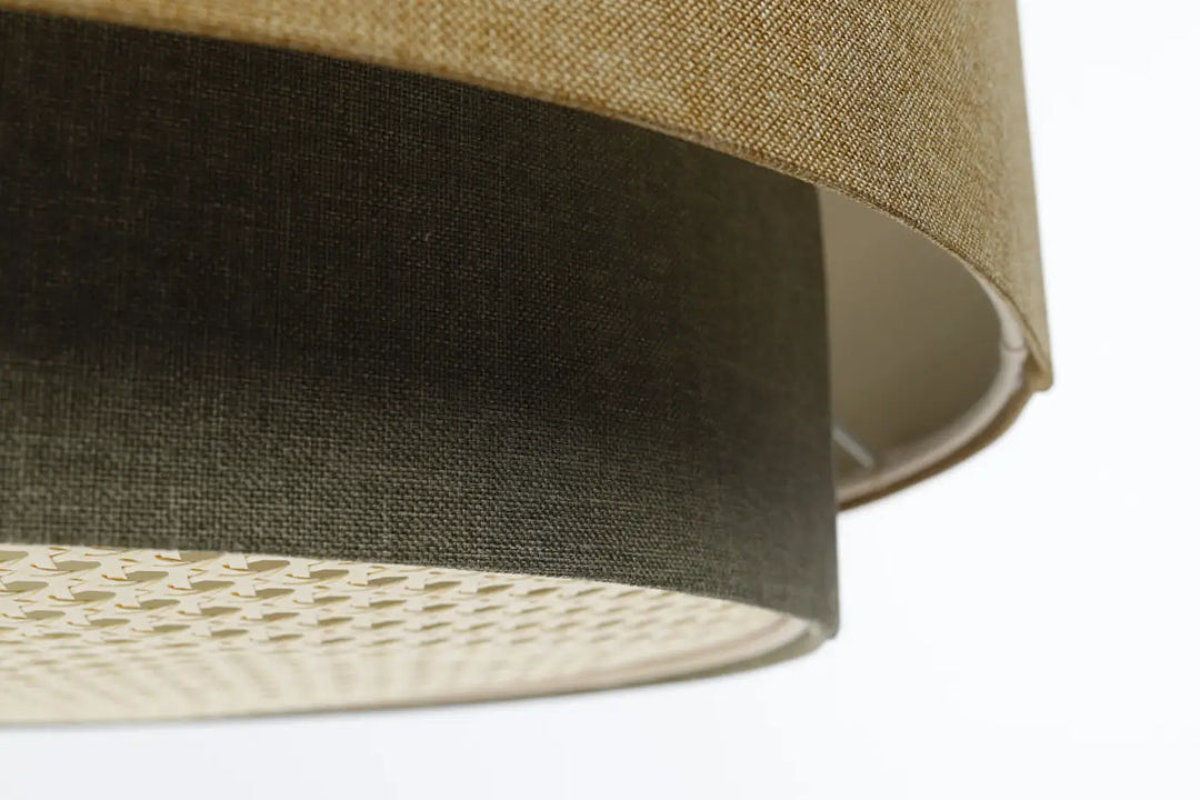 Suspension luminaire doblo boho elegant en lin gris vert et caramel avec un diffuseur intérieur perforé pour décoration intérieure