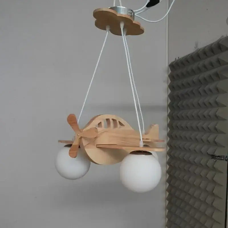 Suspension luminaire hélicoptère en bois pour chambre enfant chic