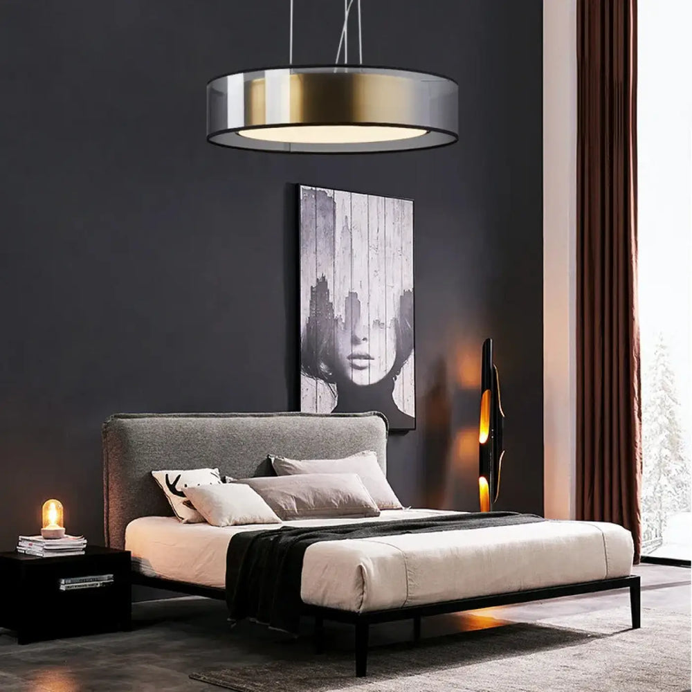 Modern suspension luminaire kylos with a round pendant light featuring metallic gold and silver finish