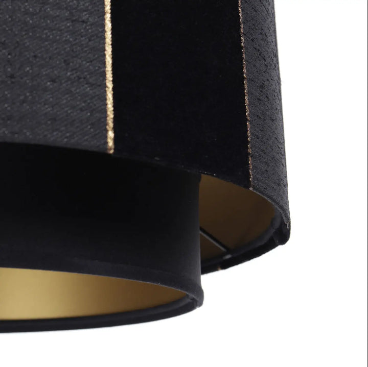 Suspension luminaire noir en velours avec rayures métalliques dorées et intérieur doré doblo