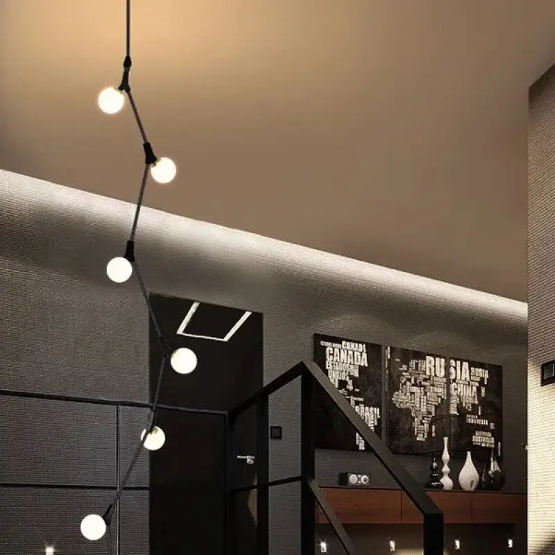 Suspension luminaire verticale en boules opales et laiton