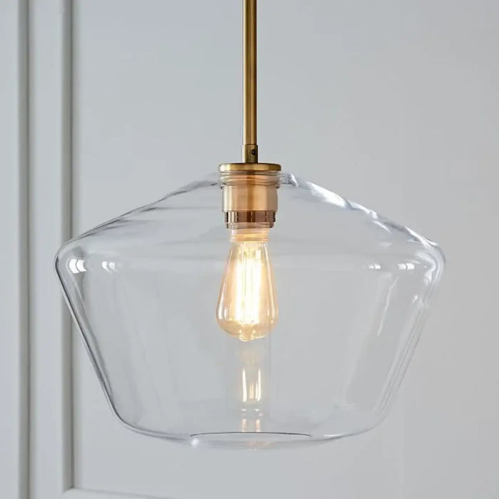 Suspension luminaire glazia en verre transparent avec tige et douille en métal doré et ampoule edison visible