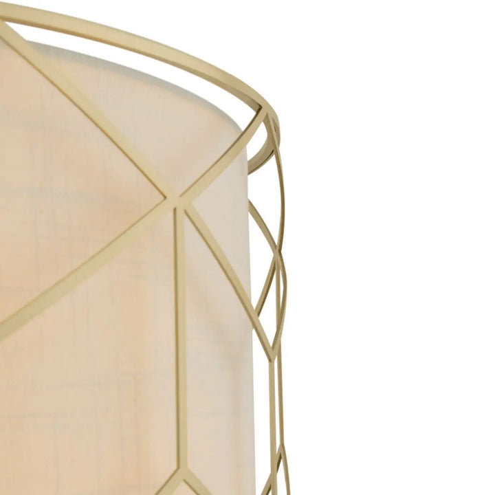 Suspension messina avec monture dorée géométrique encadrant un abat-jour en tissu crème pour lumière tamisée