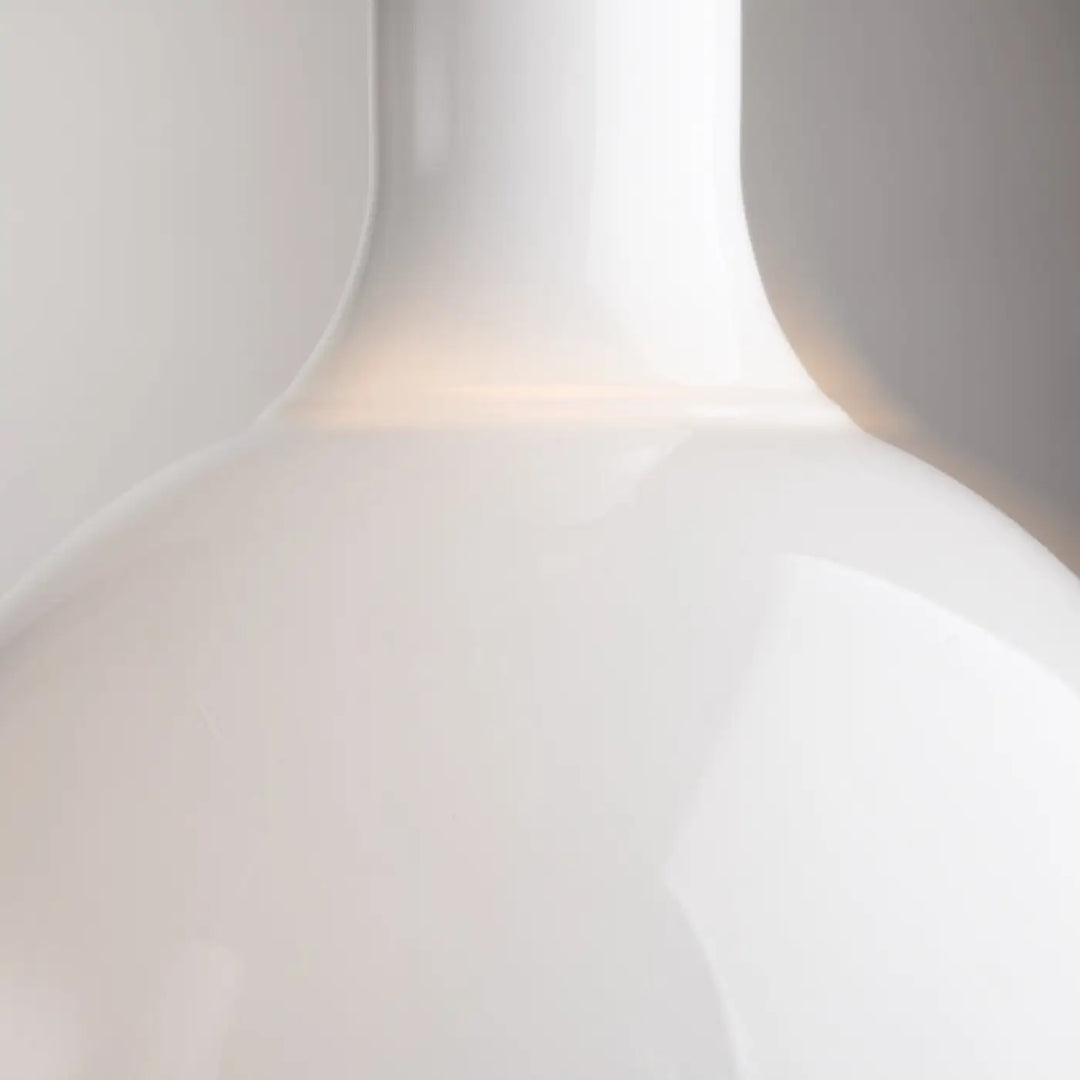 A sleek glossy white ceramic vase with a smooth rounded body and slender neck featured in suspension nebula led globe luminaire