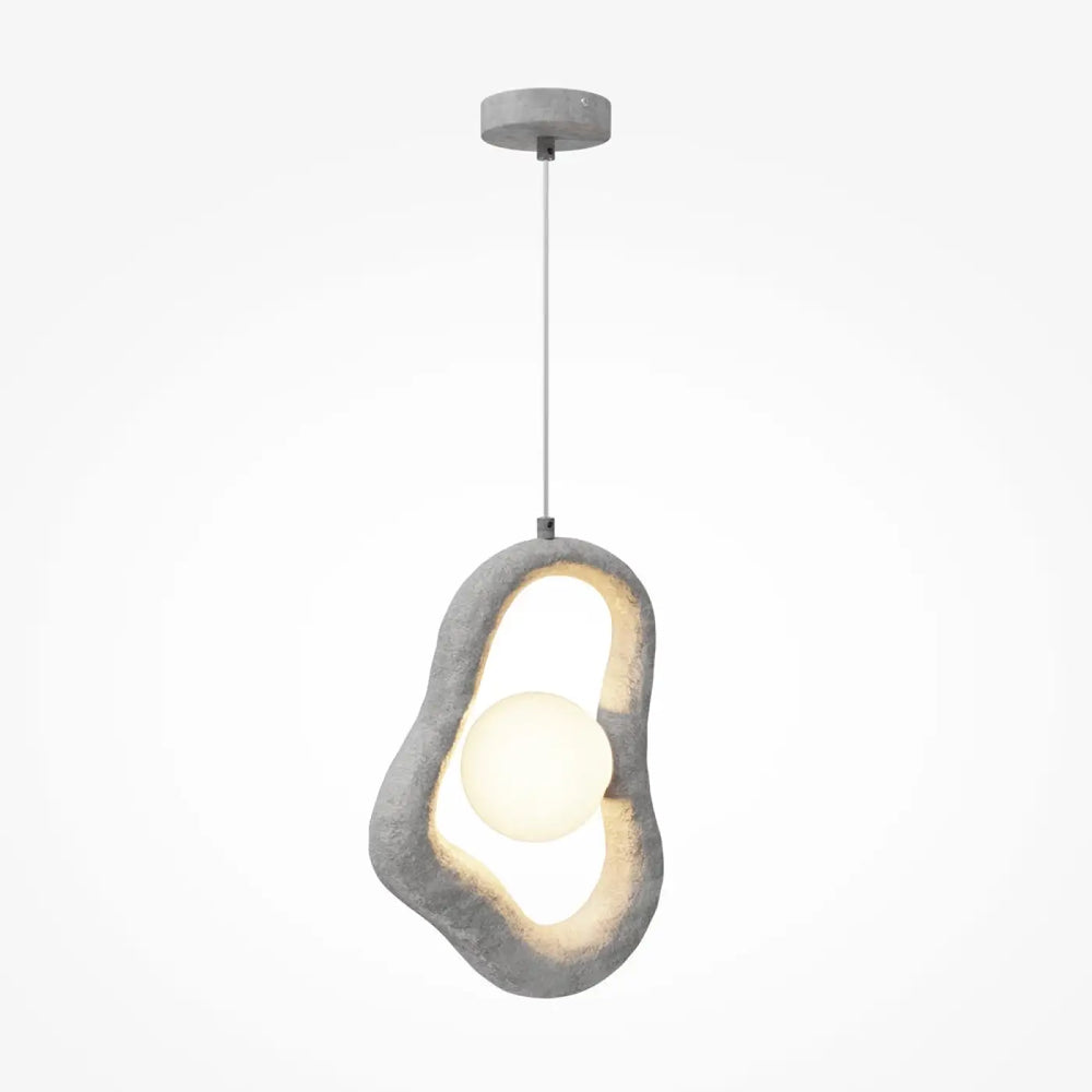 Suspension luminaire opus wabi-sabi en béton gris avec lumière douce dans un volume irrégulier unique