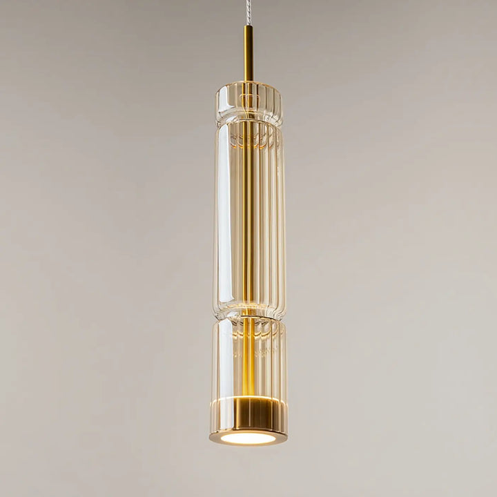 Suspension ordo led avec design cylindrique moderne en verre clair et accents métalliques dorés pour éclairage contemporain