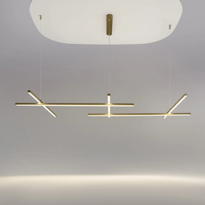 Suspension radiance ramification dorée avec trois longueurs, design minimaliste et éclairage led chaud